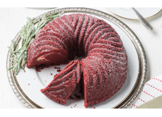 Red Velvet Bundt Cake Red Velvet Bundt Cake on white platter with rosemary