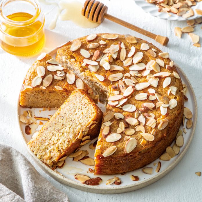 honey almond cake sliced on white plate