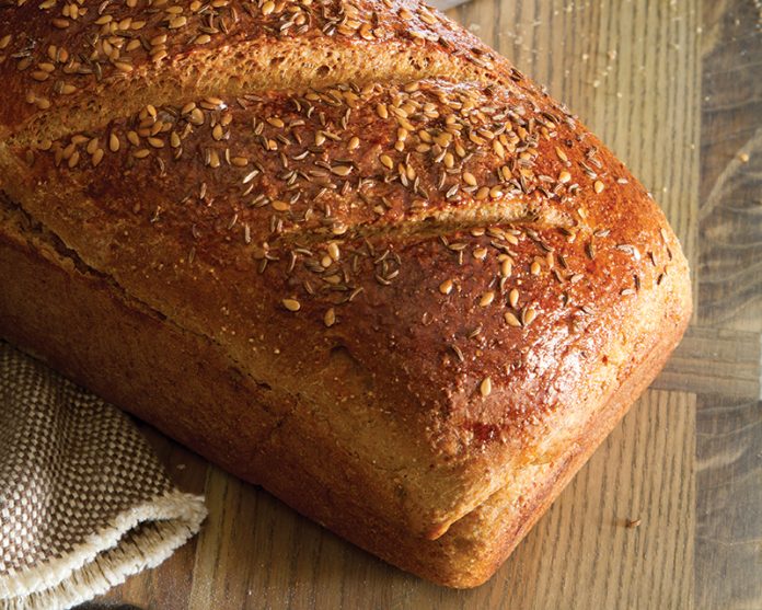 Rye Sandwich loaf bread on wooden cutting board