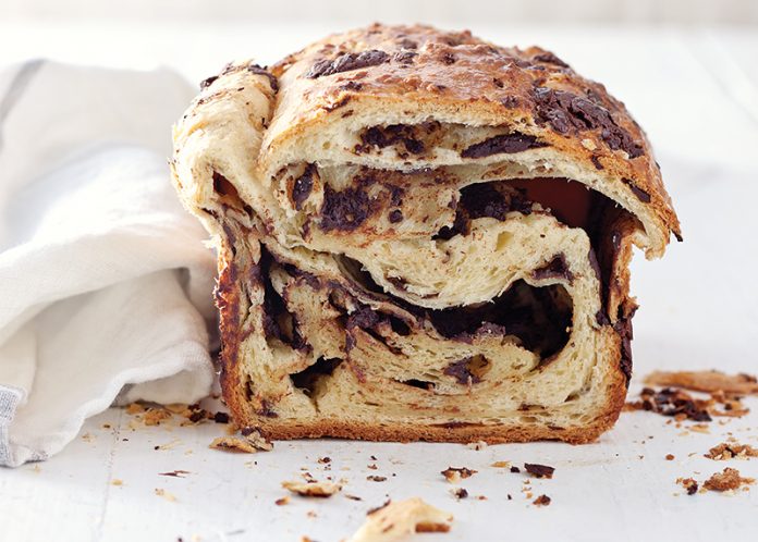 Brioche au Chocolat Loaf on white surface sliced