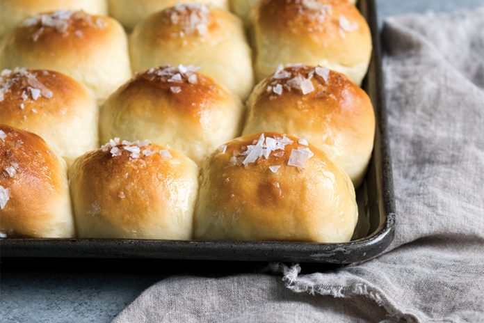 Potato Rolls on cooking sheet on gray surface baking recipe