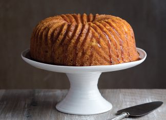 Rum-Soaked Pound Cake Rum-Soaked Pound Cake on white cake stand