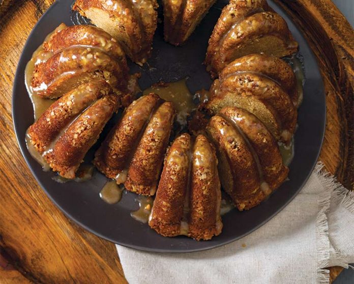 Pecan Pie Bundt sliced on black plate