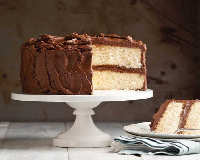 1-2-3-4 Cake: Four Ways sliced on cake stand