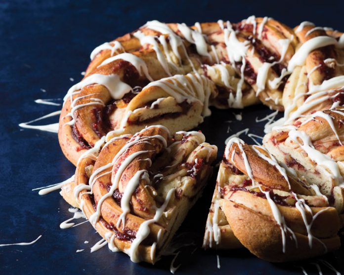 Norwegian Julekake sliced on blue surface