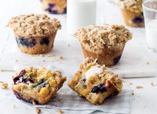 Peach and Blueberry Cornmeal Muffins Peach and Blueberry Cornmeal Muffins split with butter