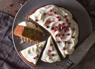 Pomegranate Molasses Gingerbread Cake Pomegranate Molasses Gingerbread Cake sliced overhead on gray plate