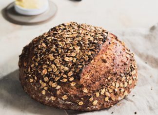 Multigrain Dutch Oven Bread Multigrain Dutch Oven Bread whole on linen