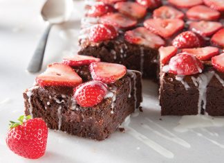 Strawberry Lillet Brownies Strawberry Lillet Brownies on white sliced and topped with strawberries baking recipe