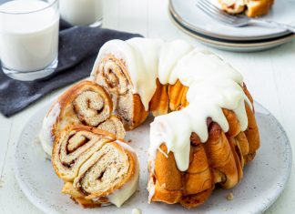 Cinnamon Roll Bundt Cinnamon Roll Bundt sliced on white plate