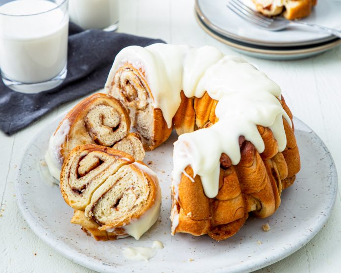 Cinnamon Roll Bundt sliced on white plate
