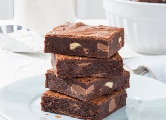 February: The Ultimate Brownies The Ultimate Brownies stacked on white plate