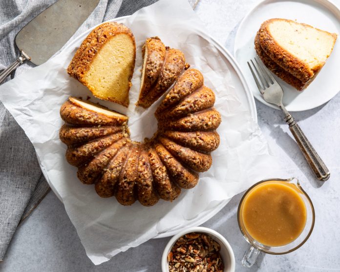 Pecan Bundt Cake sliced on parchment