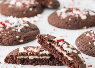 Peppermint Custard-Stuffed Chocolate Cookies Peppermint Custard-Stuffed Chocolate Cookies split in half on white