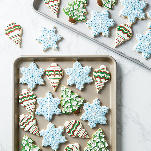 Iced Holiday cookies on cookie sheet - Bake from Scratch