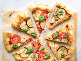Ratatouille Pizza ratatouille pizza sliced on parchment paper