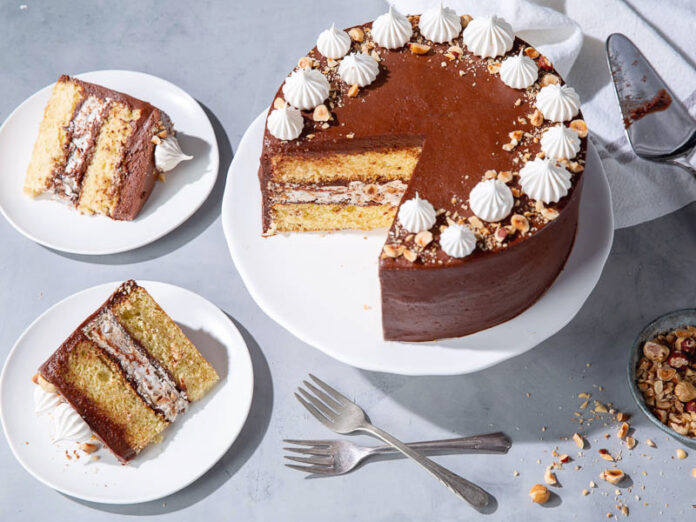 kyiv cake sliced, high angle on blue gray surface