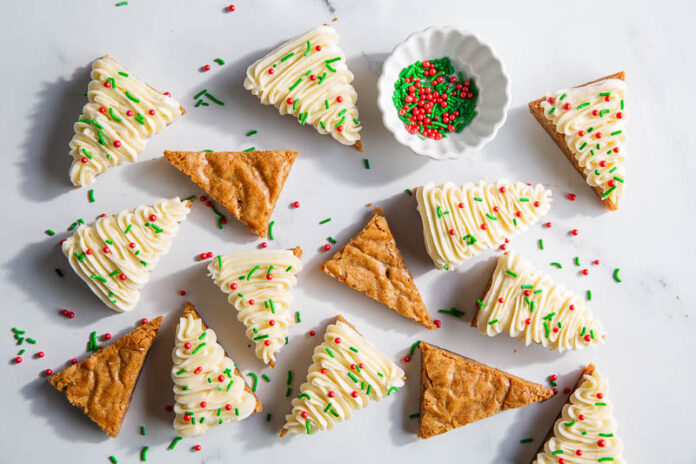 heilala gingerbread blondies topped with buttercream and sprinkles