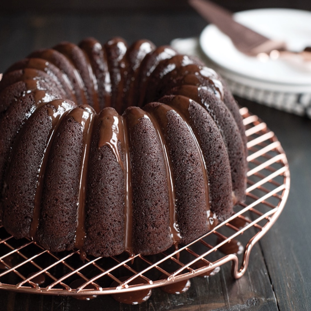 Chocolate bundt cake on cooling tray