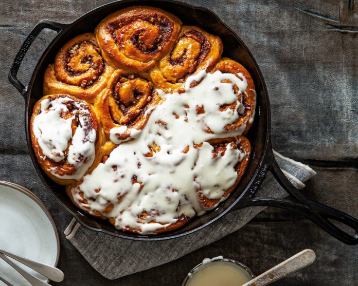 sweet potato cinnamon buns in cast iron skillet