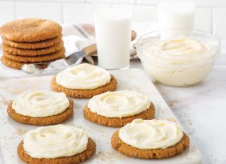 Molasses Ginger Crinkle Cookies with Orange Cream Cheese Frosting Molasses Ginger Crinkle Cookies with Frosting with glasses of milk