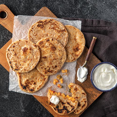 Parathas on a cutting board