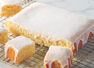 Lemon Snacking Cake with Lemon Glaze Lemon Snacking Cake with Lemon Glaze sliced on wire rack