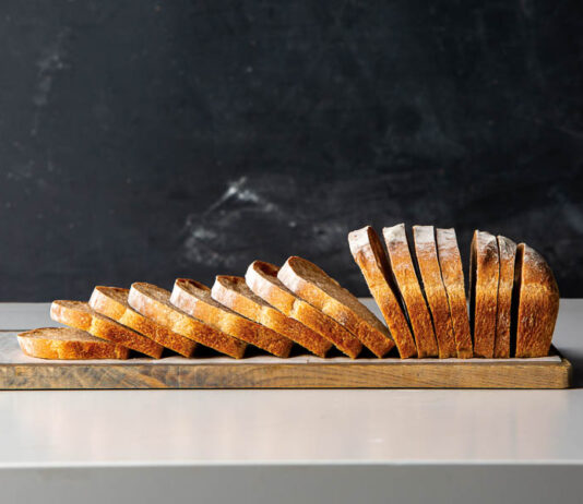 Sourdough Sandwich Loaf Sliced loaf of sourdough bread on a cutting board