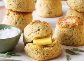 Sage Browned Butter Biscuits browned butter sage biscuits on parchment with a bowl of salt