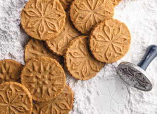 Pressed Speculaas Pressed Speculaas on a bed of powdered sugar.