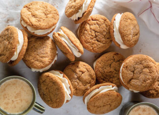 Eggnog-Molasses Sandwich Cookies Eggnog-Molasses Sandwich coookies stacked on each other photographed overhead.