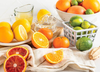 From the Pantry: Citrus Citrus stacked on white marble with juice and zest