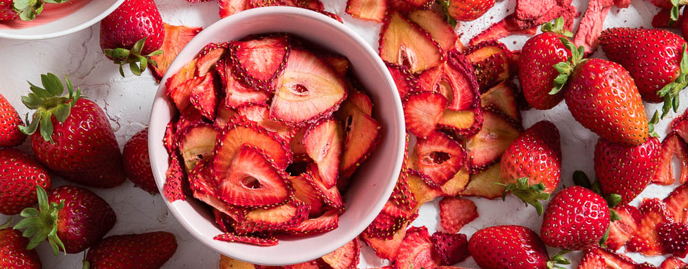Our Nine Favorite Strawberry Recipes Strawberries in bowl and on parchment