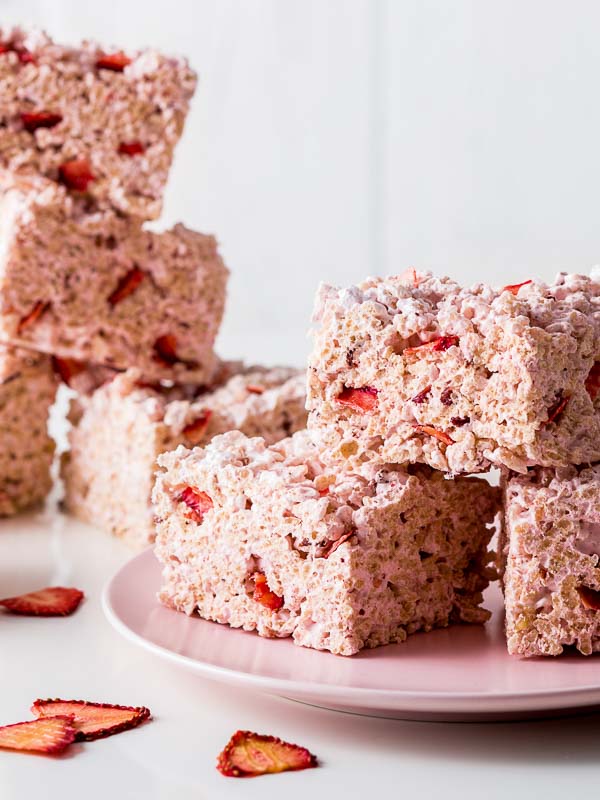 Crispy Strawberry Treats on Pink plate with dried strawberries