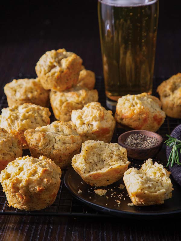 Beer-Cheddar Muffins on Black Plate with Beer Glass
