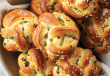 Sesame-and-Green Onion Knots Sesame-and-Green Onion Knots in bowl with linen napkin on marble
