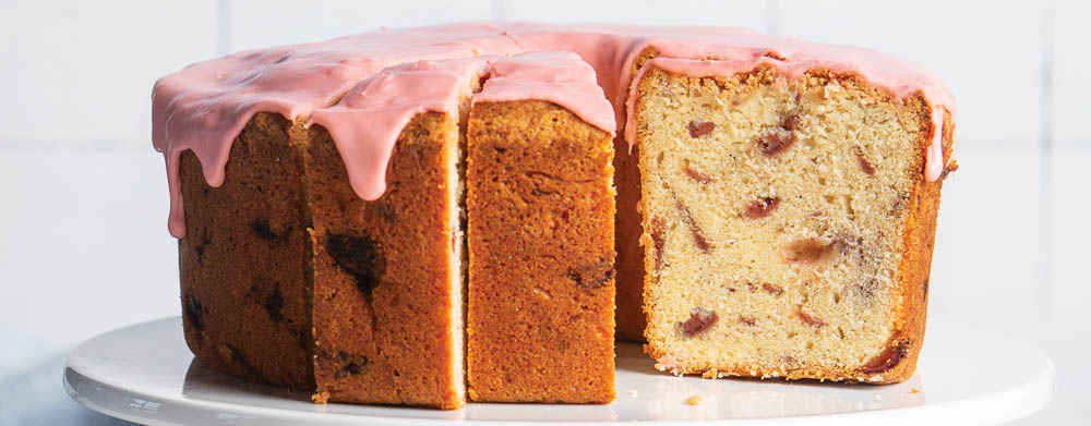 Roasted Strawberry Pound Cake baked on white cake stand recipe